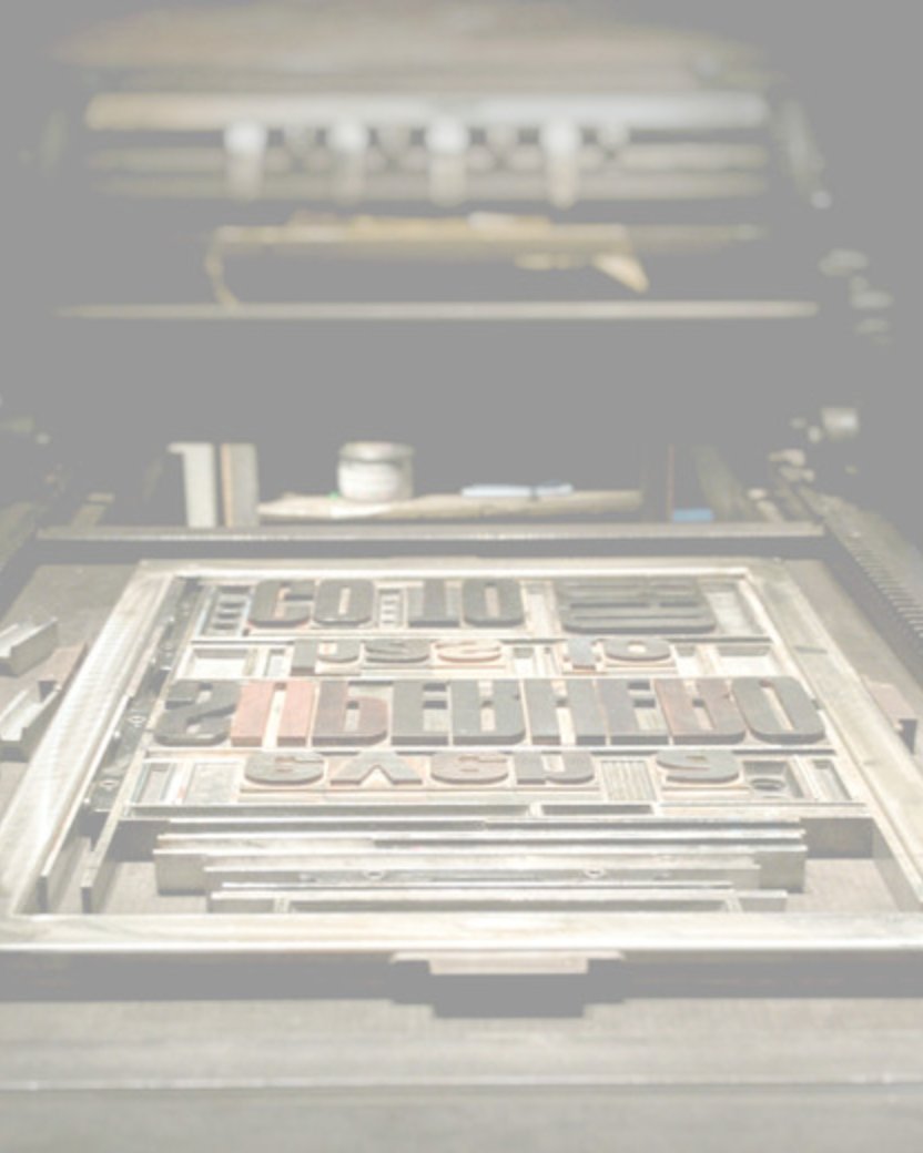 Wood type set in a chase on the bed of an LPG letterpress, ready to print